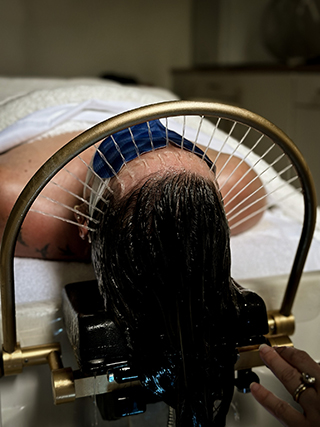 Woman Receiving Classic Head Spa Treatment